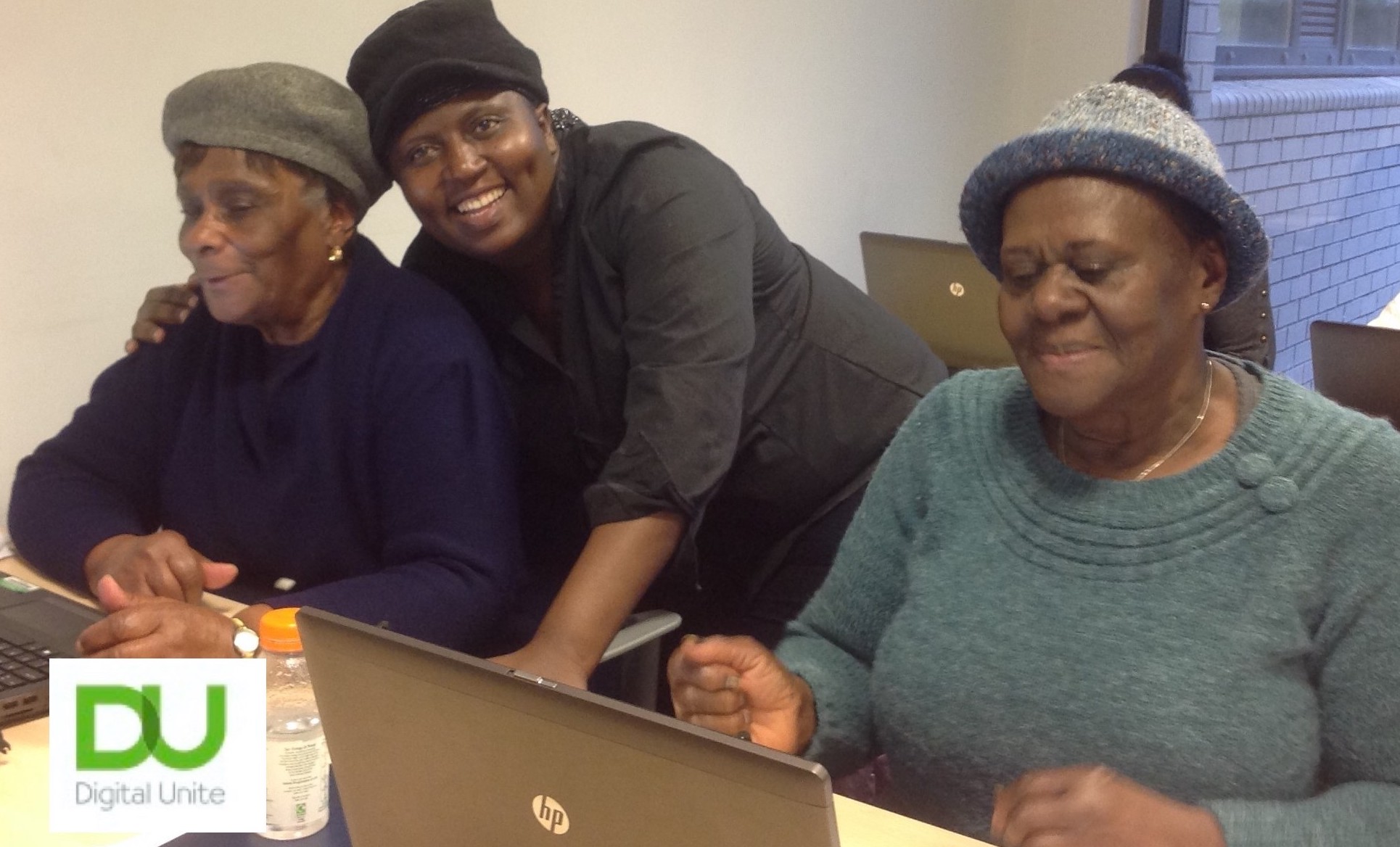 3 ladies at computers