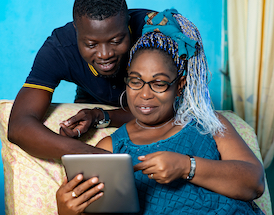 couple looking at an ipads
