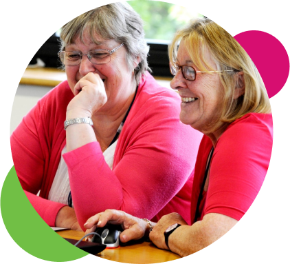 Women smiling at computer