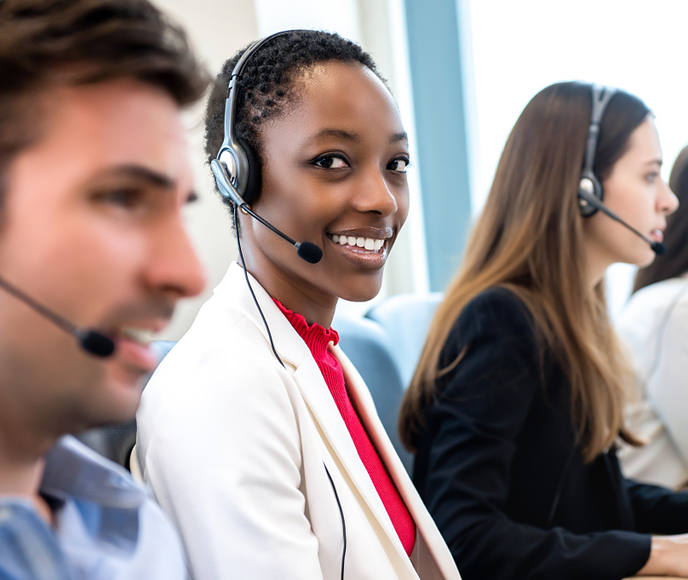 woman in a call centre, smiling
