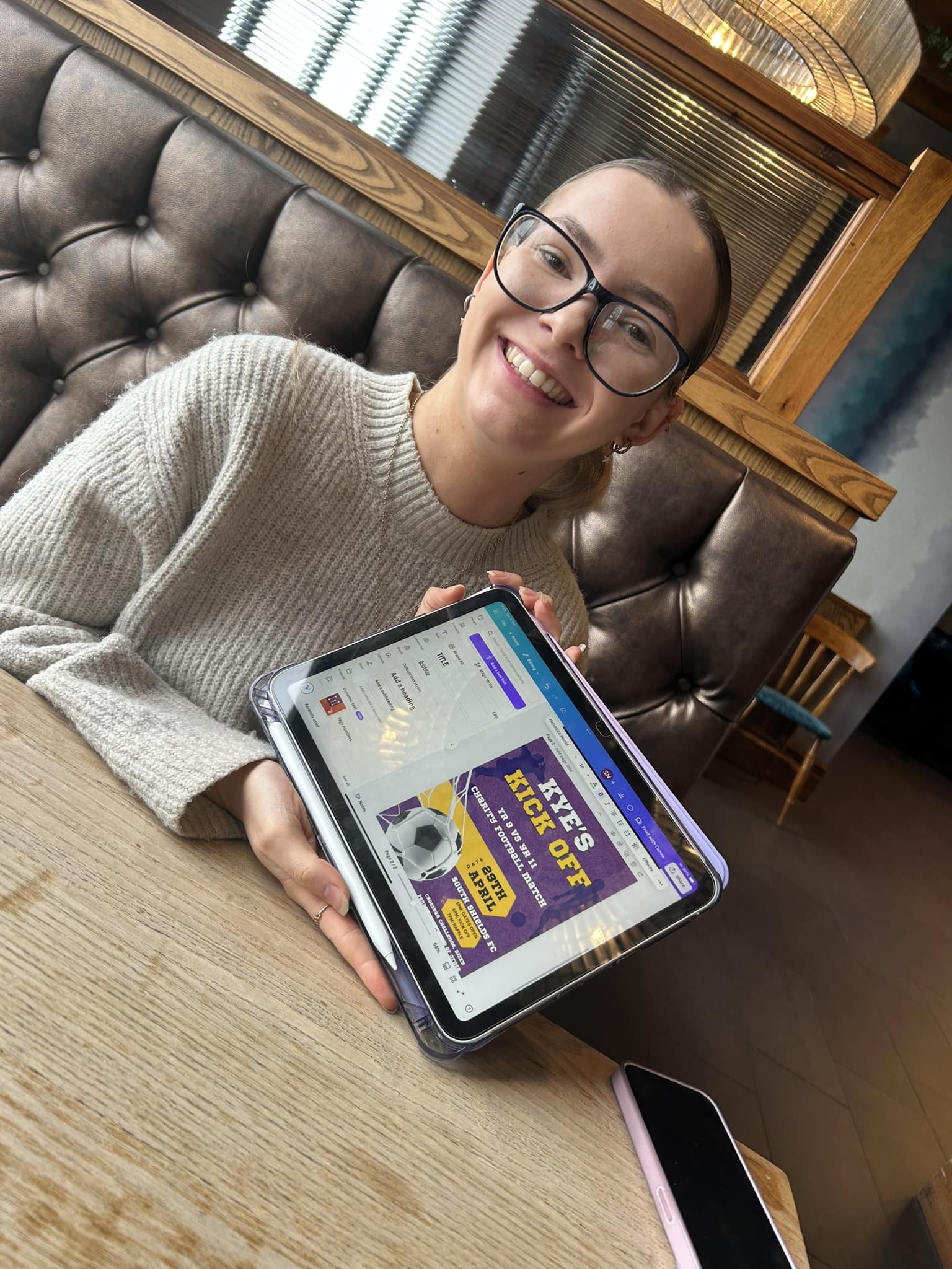 smiling woman with a tablet