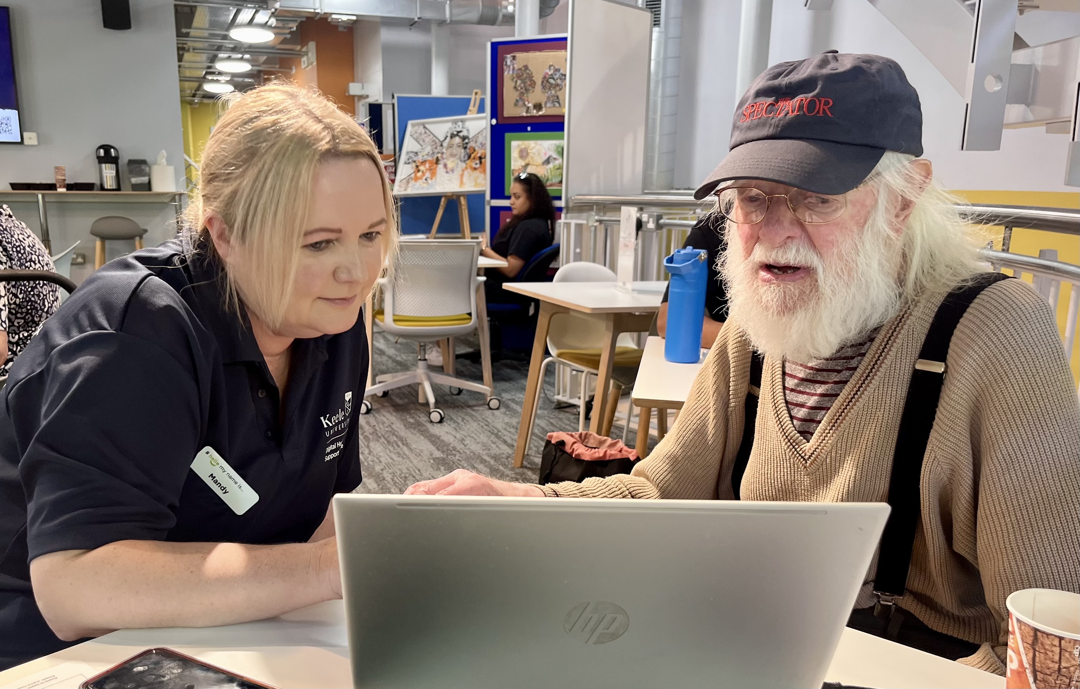 two people looking at a screen in a digital skills class