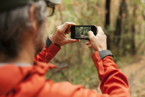 Man taking a picture with phone