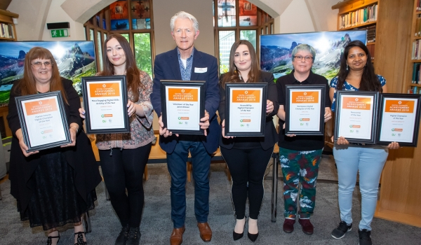 digital champions award winners smiling with their awards