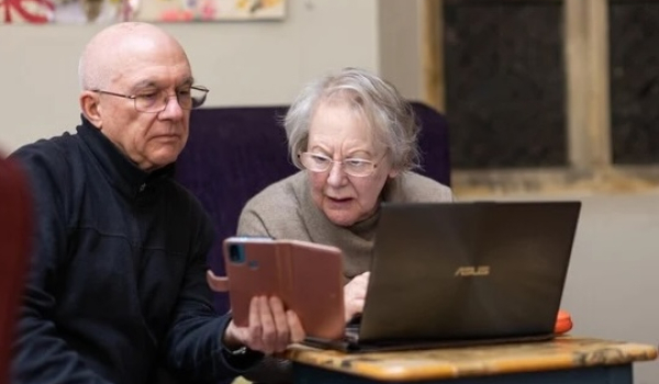two people looking confused at a tablet