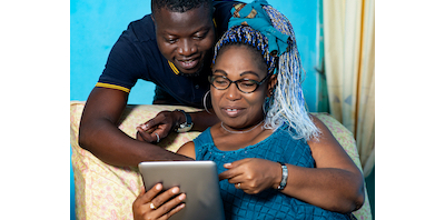 mum and son looking at an iPad