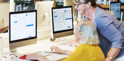 two women in a digital skills session at a library