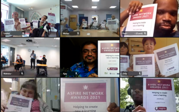 Adults with learning disabilities showing their Aspire certificates