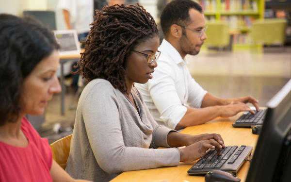 woman at computer in library
