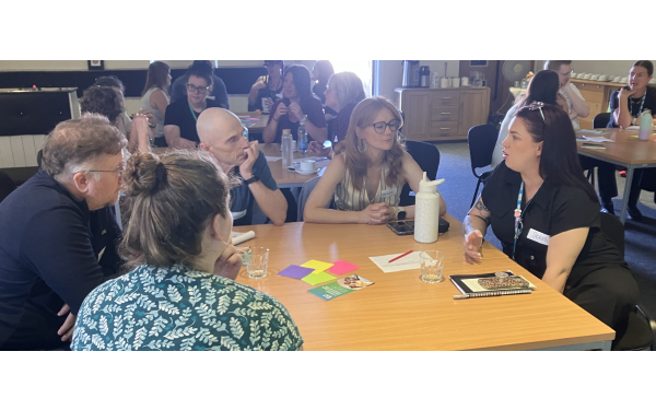people at a digital inclusion discussion round table