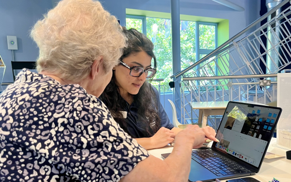 a person helping someone at a drop in session