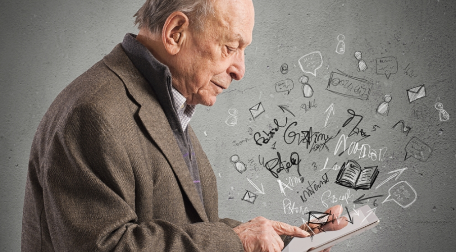 Man on a tablet, figures flying out of it