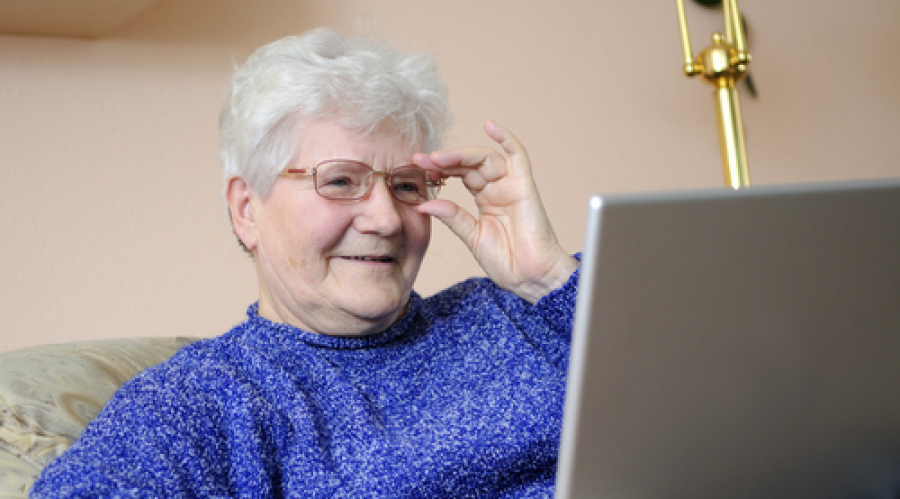 woman looking happy at a computer