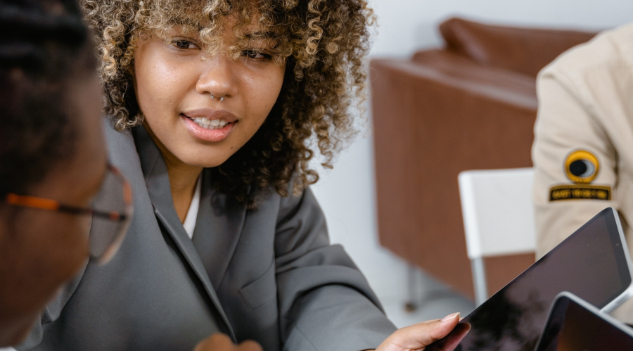 two women looking at a computer