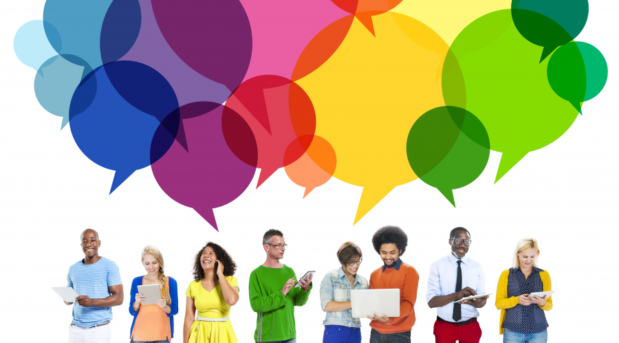 a group of people with a brightly coloured cloud of speech bubbles above them