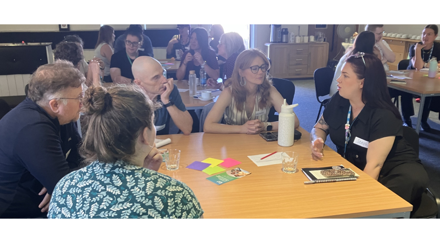 people at a digital inclusion discussion round table