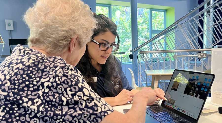a person helping someone at a drop in session